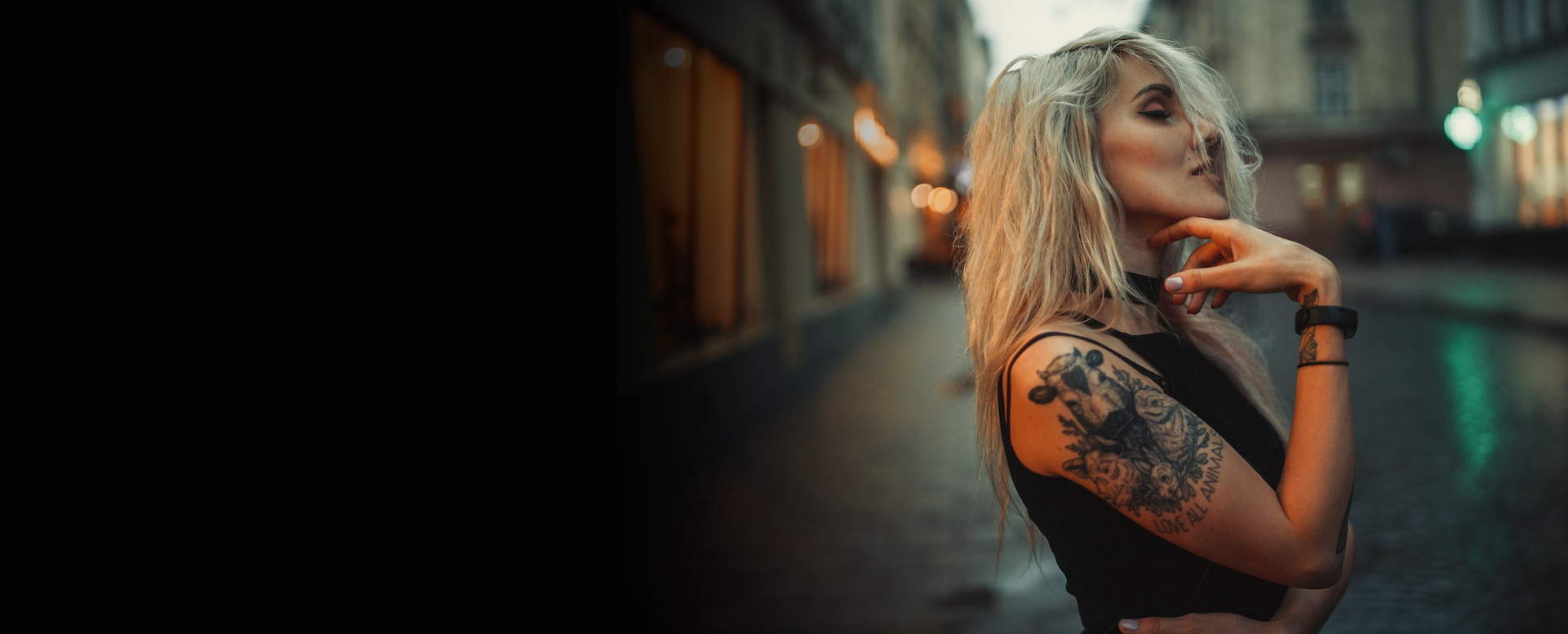 Young blonde girl with right arm tattoo